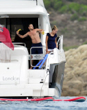 EXC - Liam Payne throws bananas in the sea