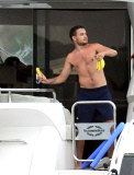 EXC - Liam Payne throws bananas in the sea