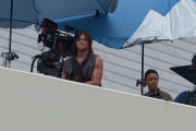 *EXCLUSIVE* Norman Reedus aims from a rooftop for 'The Walking Dead'