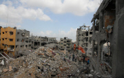 Gaza residents return to their district in ruins