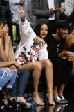 Rihanna sits courtside as Chris Brown plays in the Summer Classic Charity Game!
