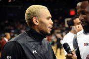 Rihanna sits courtside as Chris Brown plays in the Summer Classic Charity Game!