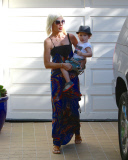 Tori Spelling and Dean McDermott pucker up at Finn Davey's birthday