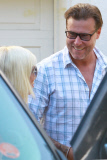 Tori Spelling and Dean McDermott pucker up at Finn Davey's birthday