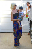 Tori Spelling and Dean McDermott pucker up at Finn Davey's birthday