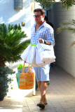 Tori Spelling and Dean McDermott pucker up at Finn Davey's birthday