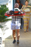 Tori Spelling and Dean McDermott pucker up at Finn Davey's birthday