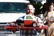 Tori Spelling and Dean McDermott pucker up at Finn Davey's birthday