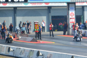 Motorcycle drag racer clings onto back of competitor's bike after high-speed crash at the Santa Pod Raceway, Bedfordshire, Britain - 10 Sep 2014