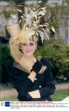 Fashion - Women - Hats - 1991 - From Hat Designer Philip Somerville Autumn / Winter Hats - Modelled By Helen Fairbrother Wears A Gold Snakeskin Gold Feathers Hat A550