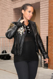 Alicia Keys shows off a rocker look with a black leather jacket and a baby bump