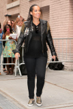 Alicia Keys shows off a rocker look with a black leather jacket and a baby bump