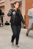 Alicia Keys shows off a rocker look with a black leather jacket and a baby bump