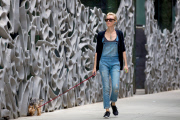 Naomi Watts rocks overalls while taking her pooch for a walk