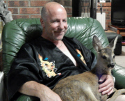 4-month-old orphan deer thinks that she is a dog, Hemsby, Norfolk, Britain - 17 Sep 2014