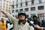 Five Stars Movement Leader Beppe Grillo is challenged during his visit to the flooded areas in Genoa, Italy - 14 Oct 2014