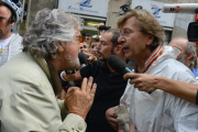 Five Stars Movement Leader Beppe Grillo is challenged during his visit to the flooded areas in Genoa, Italy - 14 Oct 2014