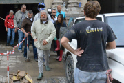 Five Stars Movement Leader Beppe Grillo is challenged during his visit to the flooded areas in Genoa, Italy - 14 Oct 2014