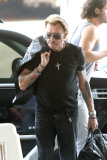 French singer Johnny Hallyday departs LAX with his whole family