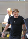 French singer Johnny Hallyday departs LAX with his whole family
