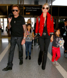 French singer Johnny Hallyday departs LAX with his whole family