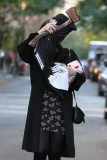 A Makeup Free Liv Tyler Hides Face from Photographers Carrying a Hatchet and Skeleton Costume