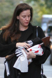 A Makeup Free Liv Tyler Hides Face from Photographers Carrying a Hatchet and Skeleton Costume