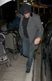 Sacha Baron Cohen and Isla Fisher at LAX with the girls