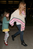 Sacha Baron Cohen and Isla Fisher at LAX with the girls