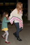 Sacha Baron Cohen and Isla Fisher at LAX with the girls