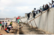 Qalandia Palestinian and foreign activists cross over the separated wall next to the Qalandia checkpoint
