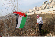 Qalandia Palestinian and foreign activists cross over the separated wall next to the Qalandia checkpoint