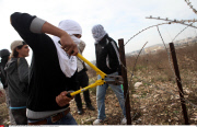 Qalandia Palestinian and foreign activists cross over the separated wall next to the Qalandia checkpoint