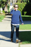 A serious Ellen Page chats on the phone as she heads to a friend's house