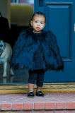 little Nori North West rocks a black fur for a play date