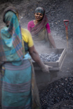 women labor working in dusty environment