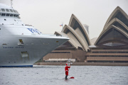 Father Christmas paddle boarding in Sydney Harbour, Australia - 18 Dec 2014