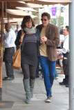 Pregnant Milla Jovovich carefully makes her way to lunch with Paul W. S. Anderson