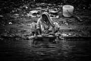 Pilgrims bathe and wash in the holy waters of the Ganges, Varanasi, India