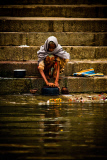 Pilgrims bathe and wash in the holy waters of the Ganges, Varanasi, India