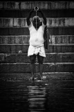 Pilgrims bathe and wash in the holy waters of the Ganges, Varanasi, India