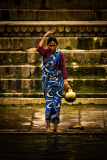 Pilgrims bathe and wash in the holy waters of the Ganges, Varanasi, India