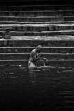 Pilgrims bathe and wash in the holy waters of the Ganges, Varanasi, India