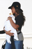 Kelly Rowland carries Titan out of Saks Fifth Ave 