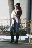 Kelly Rowland carries Titan out of Saks Fifth Ave 