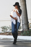 Kelly Rowland carries Titan out of Saks Fifth Ave 