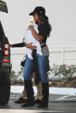 Kelly Rowland carries Titan out of Saks Fifth Ave 