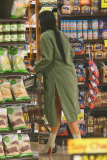 *EXCLUSIVE* Kylie Jenner grocery shops in daisy dukes, Louboutin¿s and a trench coat