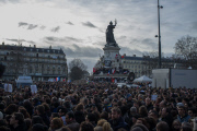 Hundreds of thousands of people fill the streets of Paris