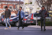 Jermaine Jackson takes a call while out with his boys